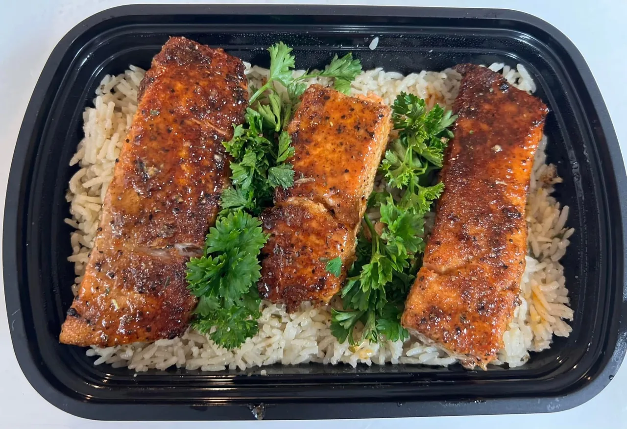Blackened salmon over rice pilaf catering tray